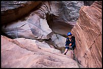 Woman rappels down in Pine Creek Canyon. Zion National Park, Utah ( color)