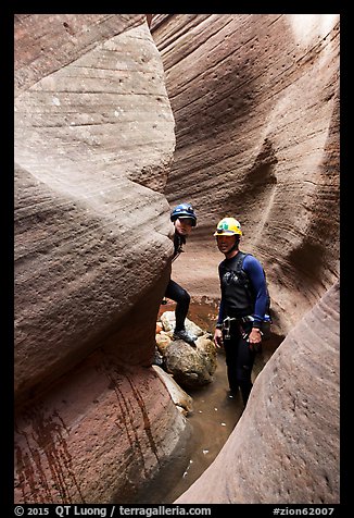 Hikers wading in Keyhole Canyon. Zion National Park, Utah (color)