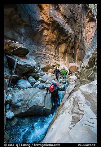 Canyoneers descend Orderville Canyon. Zion National Park, Utah (color)