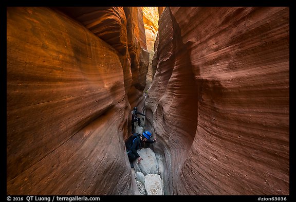 Canyoneers squeezing in Keyhole Canyon. Zion National Park, Utah (color)