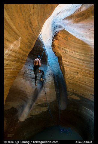 Canyoneer rappels into Keyhole Canyon. Zion National Park, Utah (color)