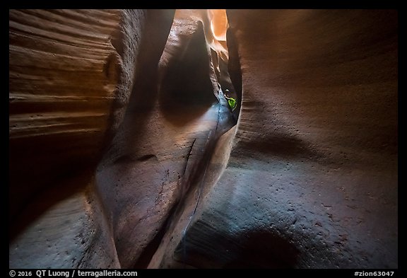 Canyoneer coiling ropes in the distance, Keyhole Canyon. Zion National Park (color)