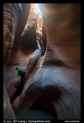 Canyoneer rappels deeps inside Keyhole Canyon. Zion National Park (color)