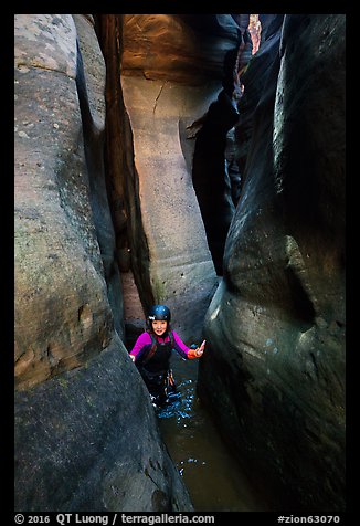 Canyoneer in tight and wet section of Das Boot Canyon. Zion National Park, Utah (color)