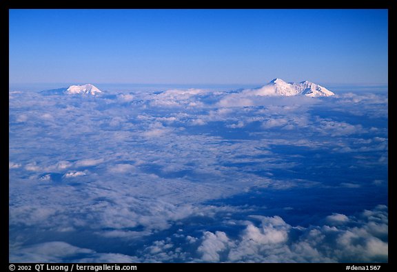 Summit of Mt Foraker and Mt Mc Kinley emerging from  clouds. Denali National Park, Alaska, USA.
