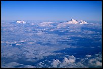 Summit of Mt Foraker and Mt Mc Kinley emerging from  clouds. Denali National Park, Alaska, USA.