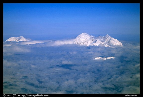 Mt Foraker and Mt Mc Kinley emerge from a sea of clouds. Denali National Park, Alaska, USA.