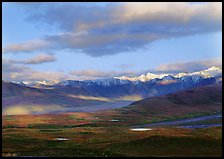 Tarn lakes, tundra, and snowy mountains of Alaska Range with patches of light. Denali  National Park ( color)