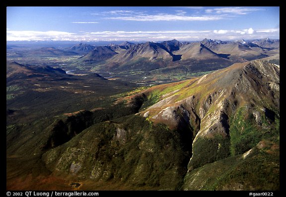 Aerial view of mountains with meandering Alatna river in the distance. Gates of the Arctic National Park, Alaska, USA.