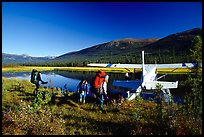 Backpackers beeing picked up by a floatplane at Circle Lake. Gates of the Arctic National Park, Alaska