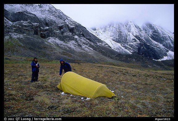 Backpackers camp at the base of the Arrigetch Peaks. Gates of the Arctic National Park, Alaska (color)