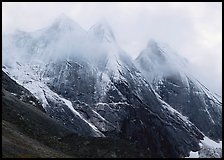 The Maidens with fresh show and a thin veil of clouds. Gates of the Arctic National Park, Alaska, USA.