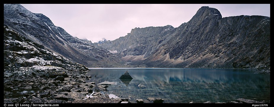 Mineral landscape with scree, rocky peaks, and lake. Gates of the Arctic National Park (color)