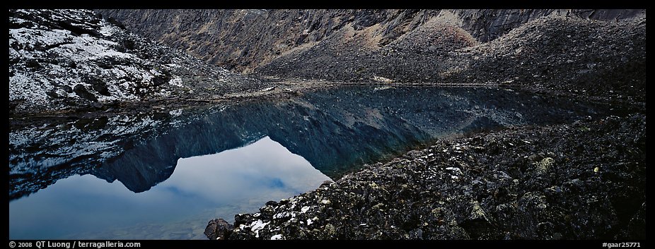 Mountain lake with reflections in rocky environment. Gates of the Arctic National Park (color)