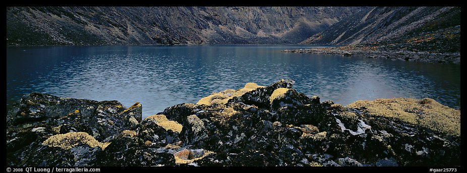 Dark rocks, lichen, and mountain lake. Gates of the Arctic National Park (color)