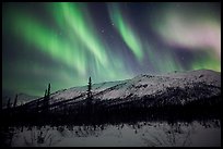 Colorful aurora curtains over Brooks Range. Gates of the Arctic National Park, Alaska, USA.