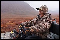 Nunamiut subsistence hunter driving Argo vehicle. Gates of the Arctic National Park ( color)