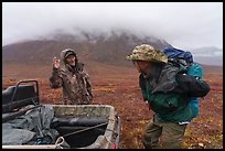 Nunamiut man dropping backpacker. Gates of the Arctic National Park ( color)