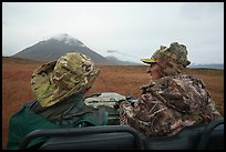 Nunamiut man and passenger on ATV. Gates of the Arctic National Park ( color)