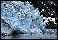 Kayaker dwarfed by Lamplugh glacier. Glacier Bay National Park ( color)