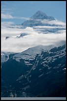 Pointed mountain with clouds hanging below. Glacier Bay National Park, Alaska, USA.