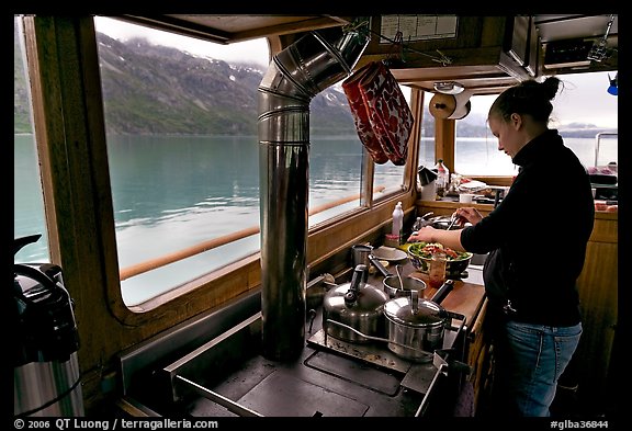 Chef preparing sadad in the main cabin of the Kahsteen. Glacier Bay National Park (color)