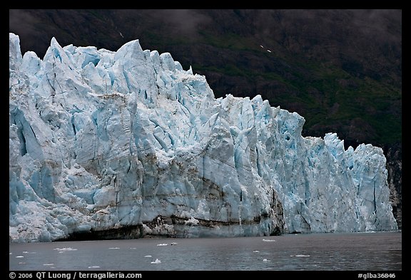 Front of Margerie Glacier against dark mountainside. Glacier Bay National Park (color)