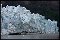 Front of Margerie Glacier against dark mountainside. Glacier Bay National Park, Alaska, USA.