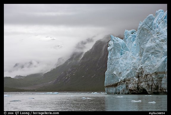 Margerie Glacier and foggy mountains surrounding Tarr Inlet. Glacier Bay National Park, Alaska, USA.