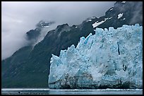 Terminal front of Margerie Glacier with blue ice. Glacier Bay National Park, Alaska, USA.