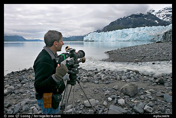 Cameraman filming in Tarr Inlet. Glacier Bay National Park, Alaska, USA.