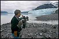Cameraman filming in Tarr Inlet. Glacier Bay National Park, Alaska, USA.