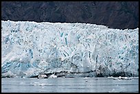 Small tour boat dwarfed by Margerie Glacier. Glacier Bay National Park, Alaska, USA. (color)