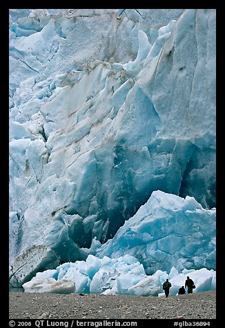 People at the base of the Reid Glacier terminus. Glacier Bay National Park, Alaska, USA.