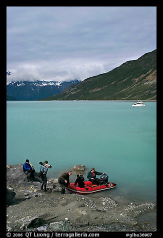 Film crew embarking on a skiff after shore excursion. Glacier Bay National Park, Alaska, USA.