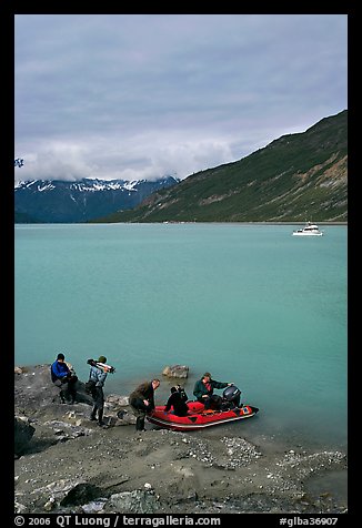 Film crew embarking on a skiff after shore excursion. Glacier Bay National Park (color)