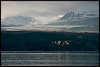 Last sunrays catched by the moraine-covered face of Grand Pacific Glacier. Glacier Bay National Park ( color)