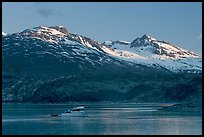 Small boat in Tarr Inlet, early morning. Glacier Bay National Park, Alaska, USA.