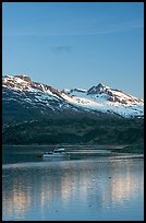 Small boat at the head of Tarr Inlet, early morning. Glacier Bay National Park, Alaska, USA. (color)