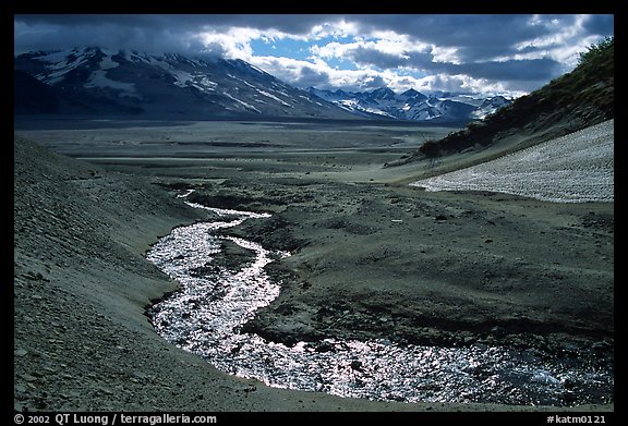 Stream flows from the hills into the floor of the Valley of Ten Thousand smokes. Katmai National Park, Alaska, USA.