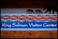 Bears and salmon on visitor center sign. Katmai National Park, Alaska, USA.