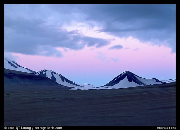 Mt Meigeck emerging above ash plain of Valley of Ten Thousand Smokes at dusk. Katmai National Park, Alaska, USA.