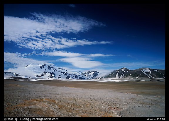 Snow-covered peaks surrounding the arid ash-covered floor of the Valley of Ten Thousand smokes. Katmai National Park, Alaska, USA.