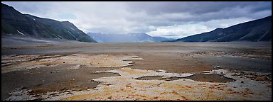 Arid ash plain landscape with colorful deposits. Katmai National Park (Panoramic color)