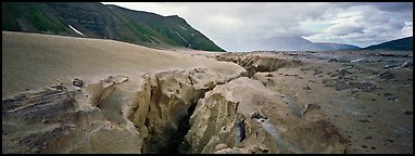 Volcanic landscape with deep gorge cut into ash valley. Katmai National Park (Panoramic color)