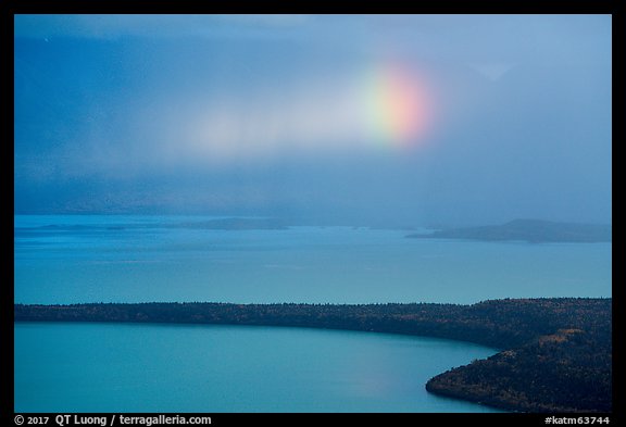 Rainbow in sun shaft piercing clouds. Katmai National Park (color)