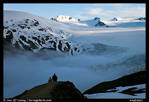 Two people hiking down Harding Ice Field trail. Kenai Fjords National Park, Alaska, USA.