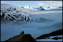 Two people hiking down Harding Ice Field trail. Kenai Fjords National Park, Alaska, USA. (color)