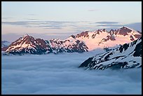 Midnight sunset on peaks above clouds. Kenai Fjords National Park ( color)