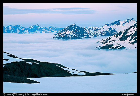 Mountains above low fog at dusk. Kenai Fjords National Park, Alaska, USA.